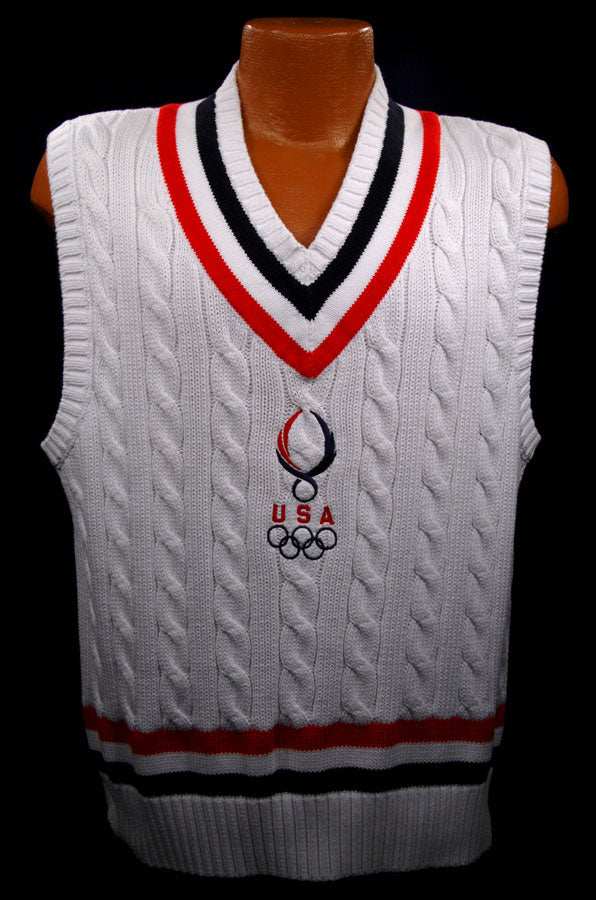 Men's USA Olympics cable-knit sleeveless tennis sweater vest by Polo Ralph Lauren in white with red, black, and white striped trim and embroidered Olympic logo.