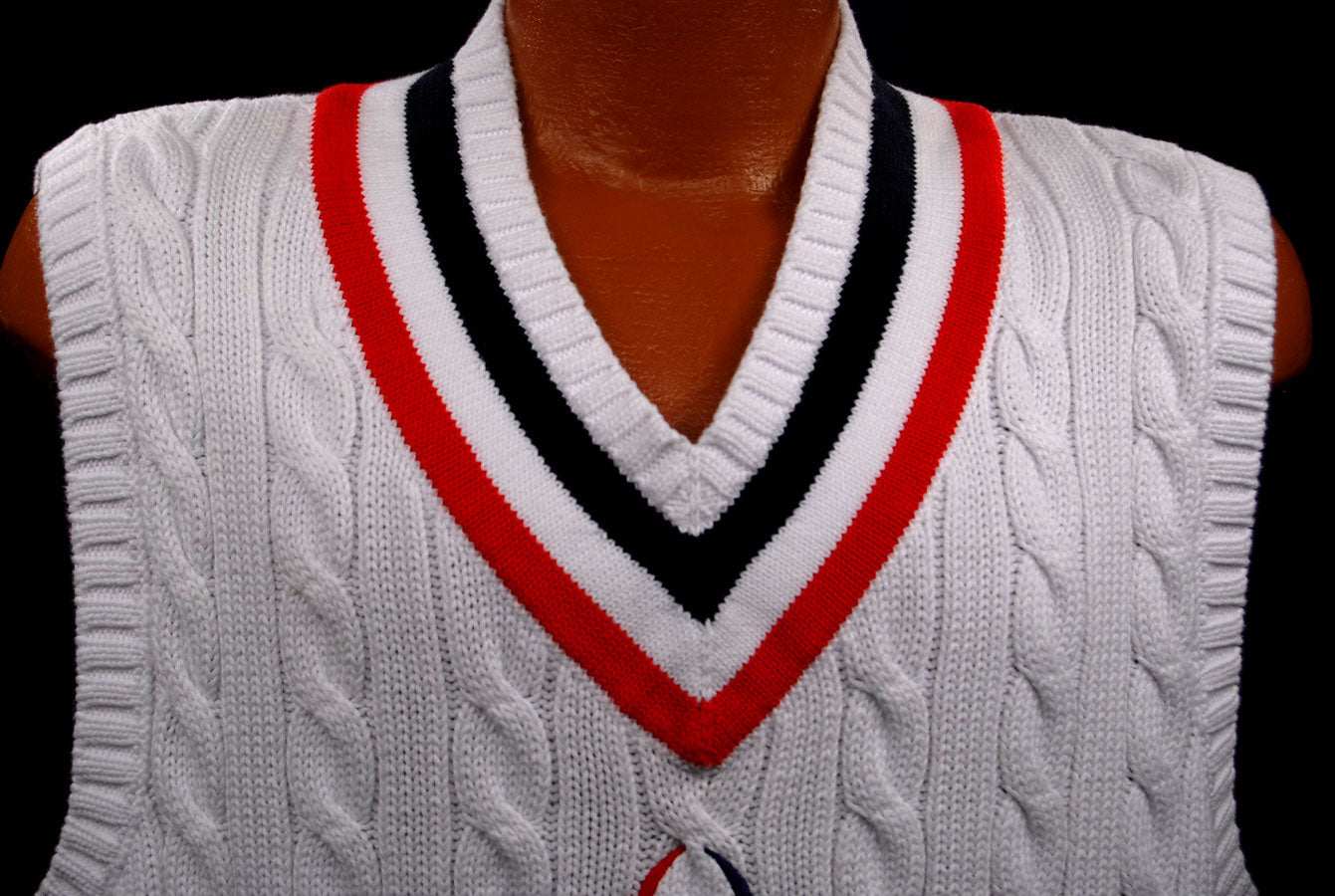 Men's white cable-knit sleeveless tennis sweater vest with red and black V-neck trim by Polo Ralph Lauren