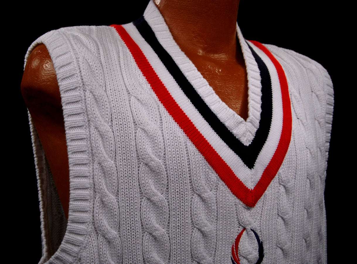Men's white cable-knit sleeveless tennis sweater vest with red and navy V-neck trim by Polo Ralph Lauren
