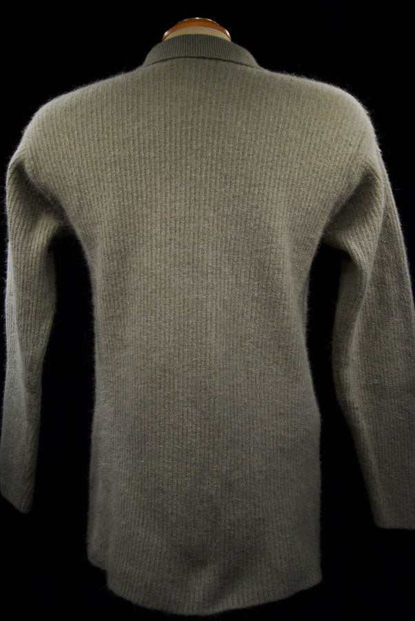 Back view of woman's olive-green angora cardigan sweater with lapels and 3/4-length sleeves