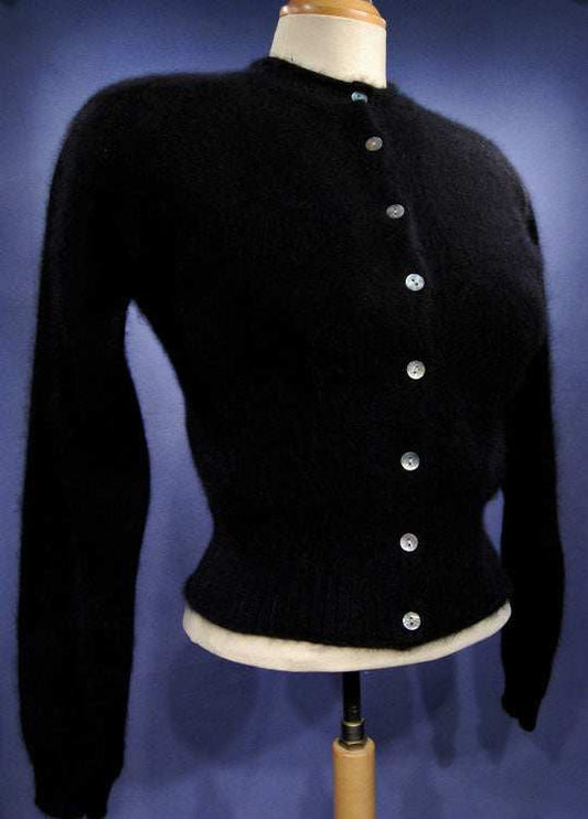 Woman's black angora button-front cardigan sweater by Express Tricot in X-Small displayed on mannequin