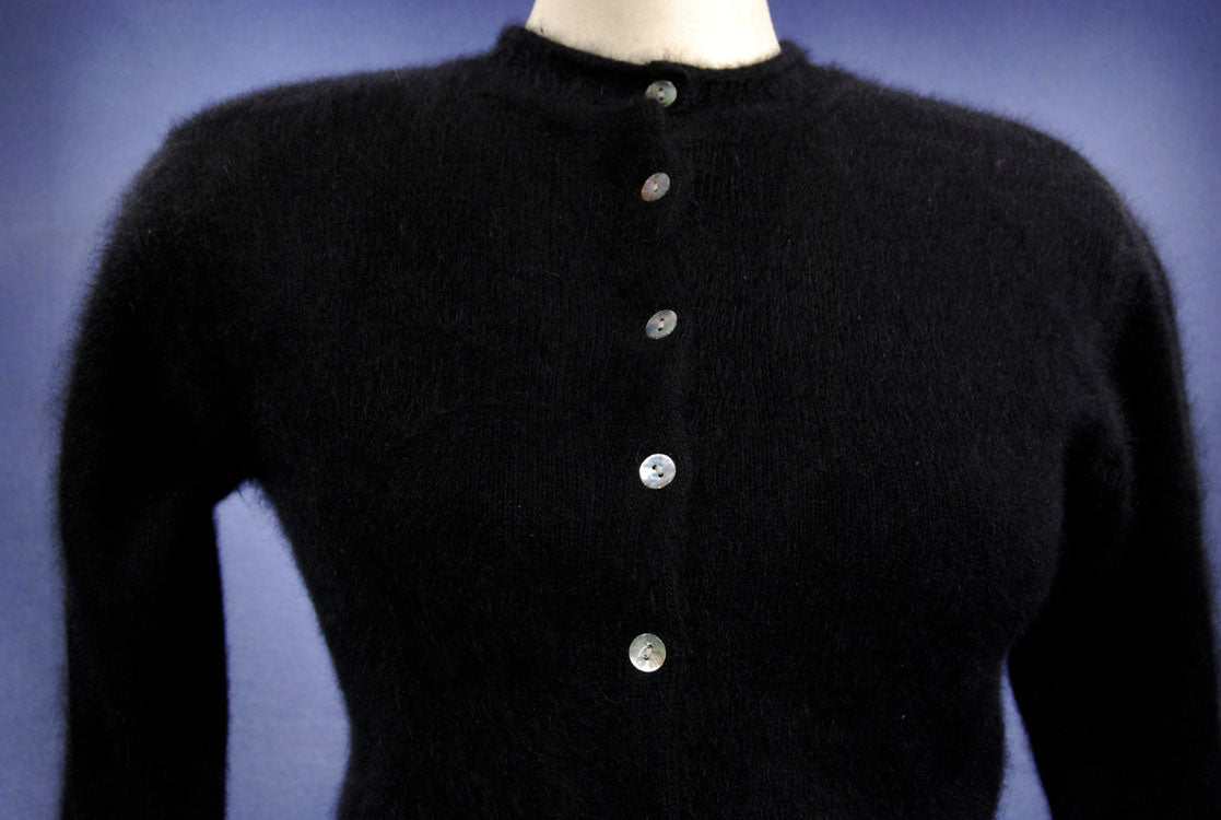 Woman's black angora button-front round-neck cardigan sweater by Express Tricot in X-Small