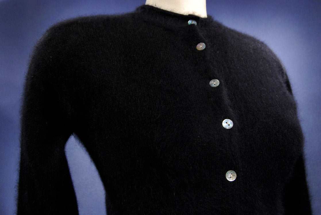 Woman's black angora button-front round-neck cardigan sweater by Express Tricot in X-Small