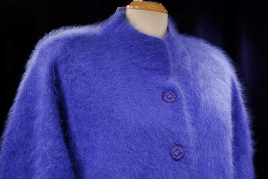 Woman's powder-blue angora cardigan sweater by Venesha on mannequin