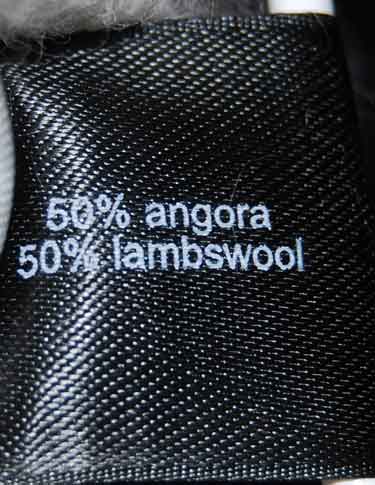 Black fabric label showing 50% angora and 50% lambswool blend.