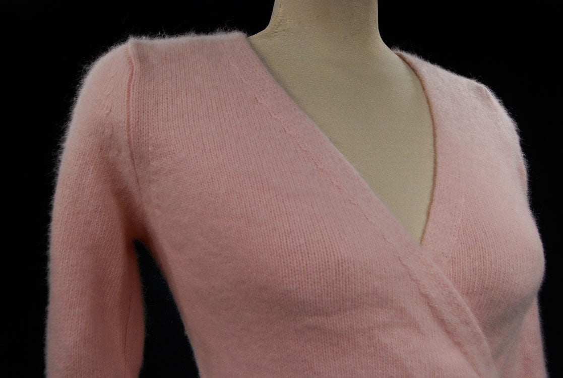 Woman's pink angora-lambswool crossover wrap cardigan sweater with side buttons