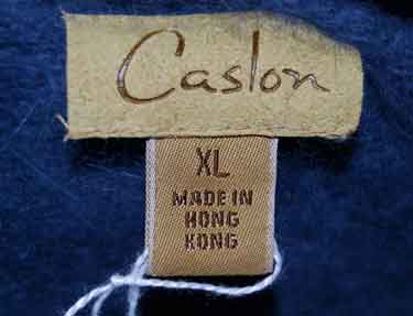 Woman's blue-grey short-sleeved angora sweater by Caslon XL tag close-up