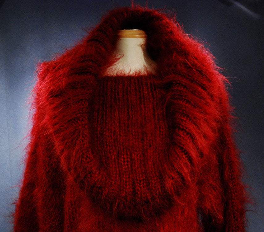 Red hand-knit fuzzy mohair sweaterdress with large cowlneck collar on mannequin