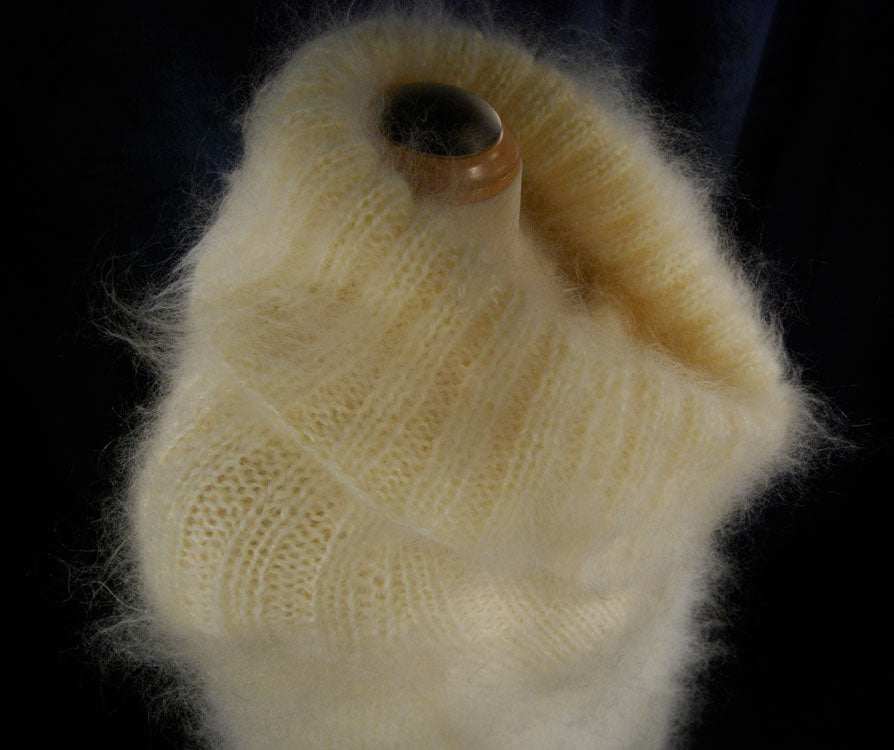 Hand-knit fuzzy mohair large cowlneck sweaterdress in cream color on mannequin