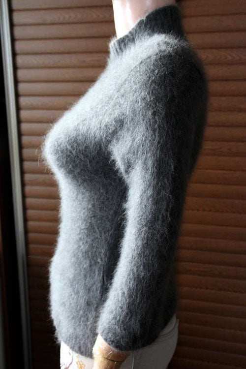 Woman's grey angora mock-turtleneck three-quarter sleeve sweater in size XS/S shown in side view