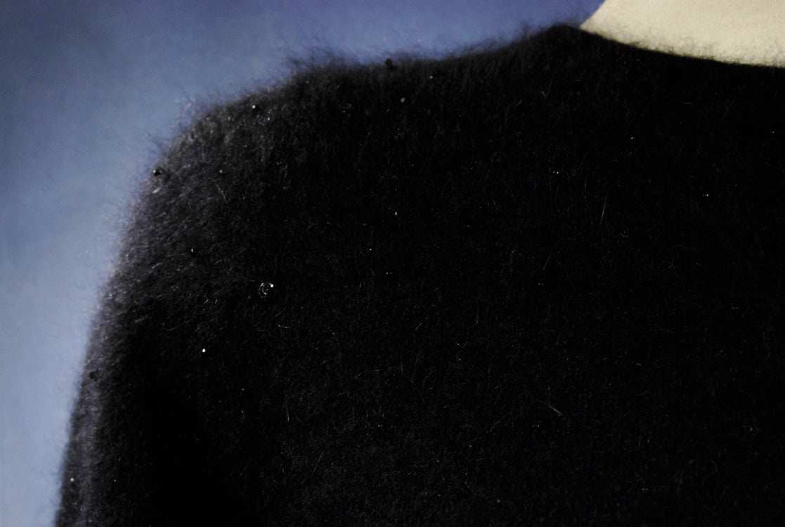 Women's black angora cardigan sweater with soft texture and hook and loop closures in size XX-Small