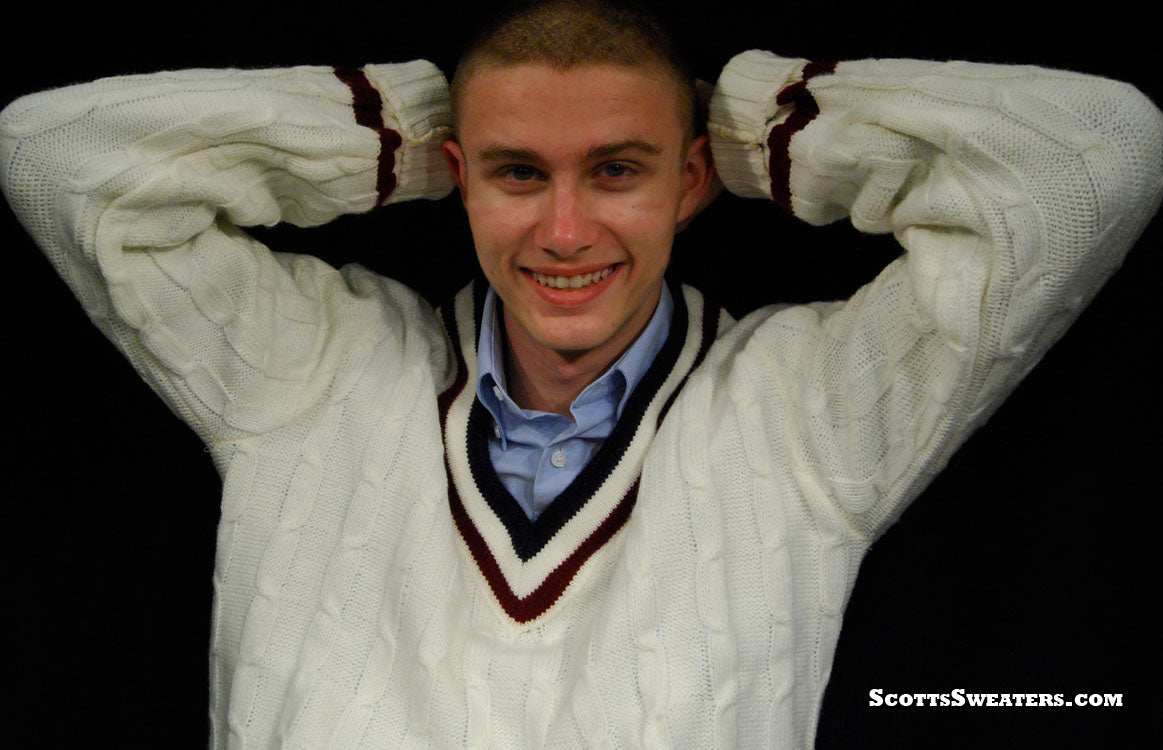 Men's Classic V-neck white cable-knit retro tennis sweater with maroon and navy trim worn by a smiling man