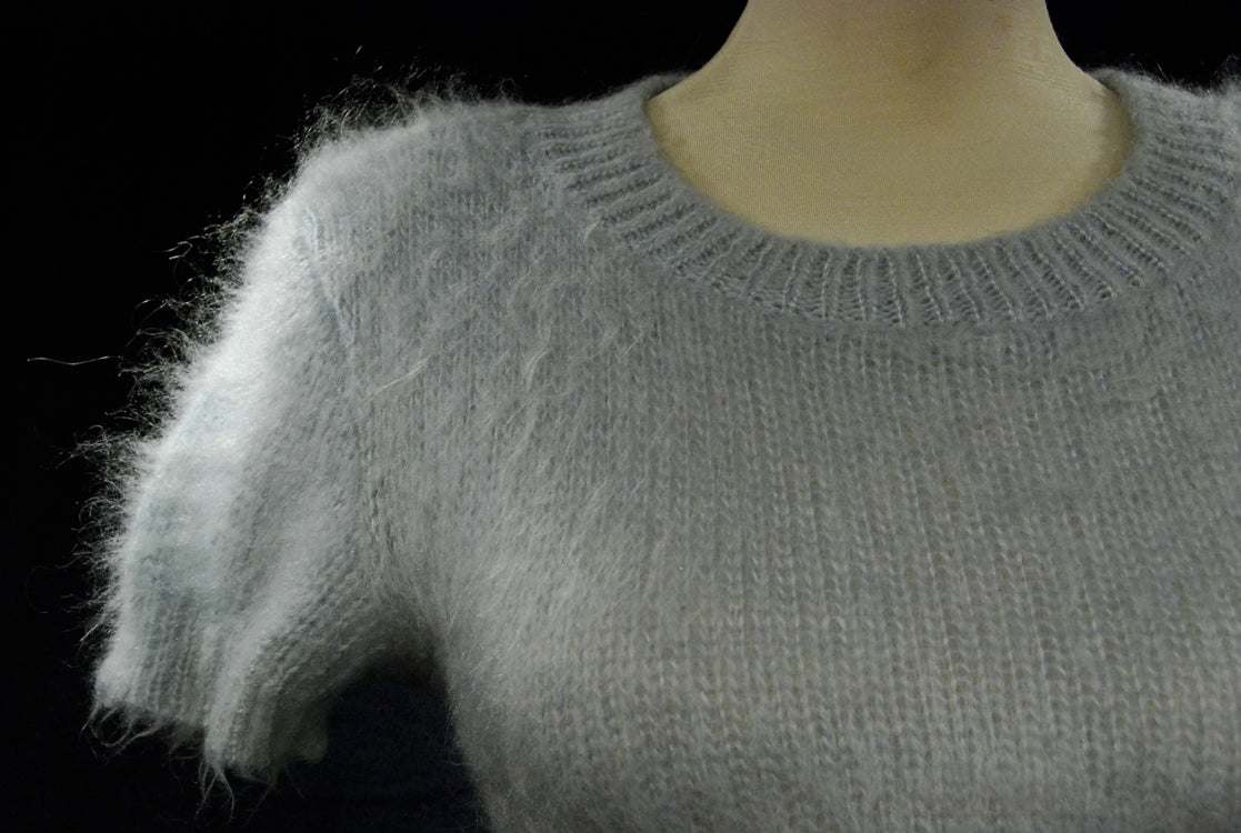 Powder-blue mohair soft fuzzy full-length sweater dress on mannequin