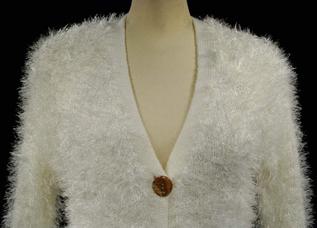 Women's white fuzzy eyelash cardigan sweater with four buttons and front pockets