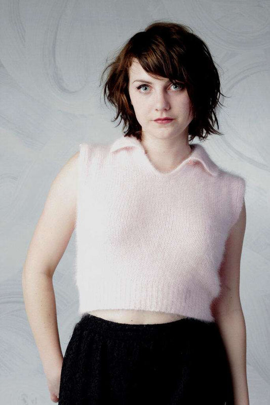 Woman wearing a pink angora cropped sleeveless polo-neck sweater by Moda Intl