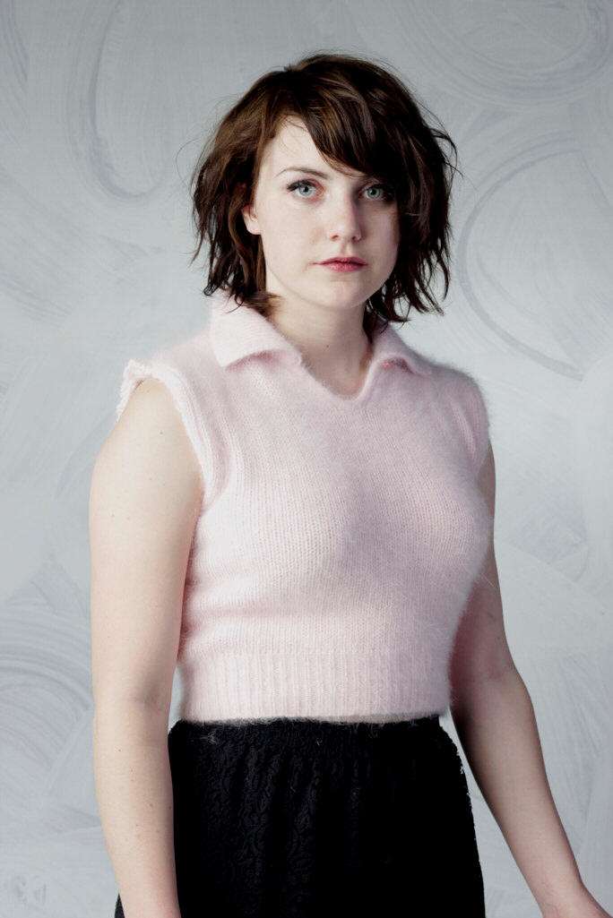 Woman wearing a pink angora cropped sleeveless polo-neck sweater by Moda Intl