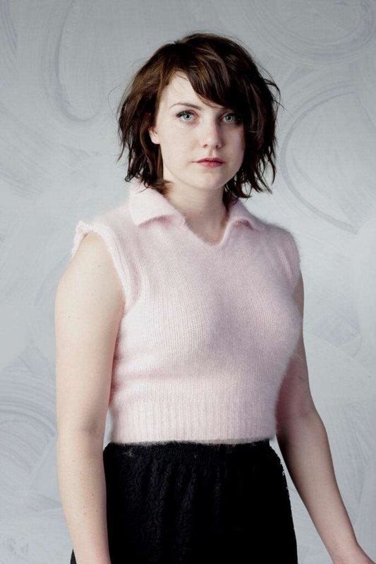 Woman wearing a pink angora cropped sleeveless polo-neck sweater by Moda Intl