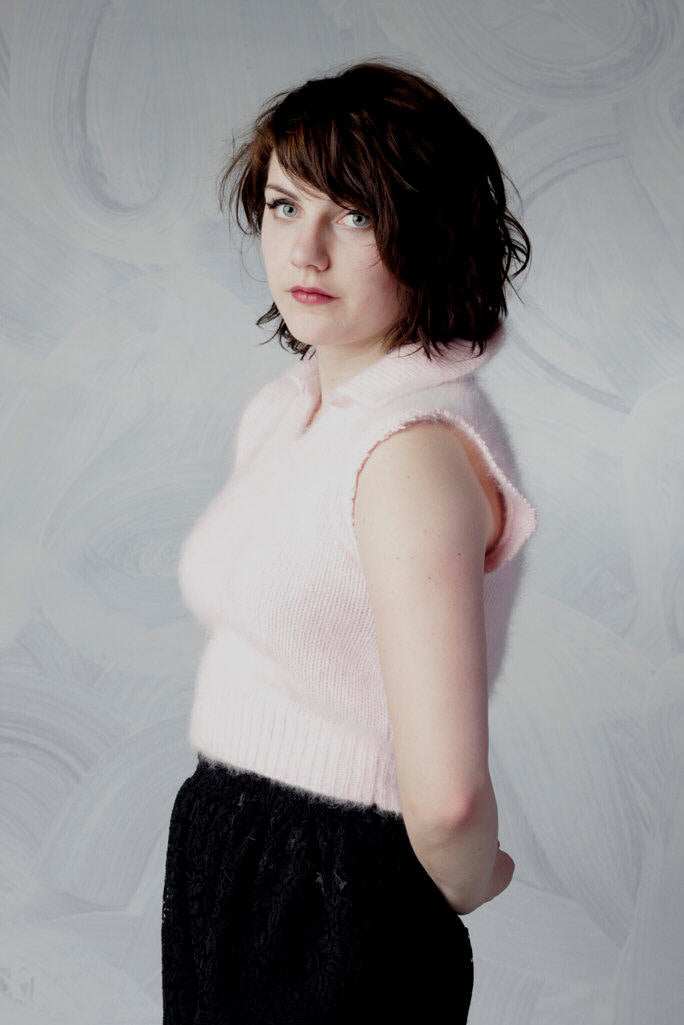 Woman wearing pink angora cropped sleeveless polo-neck sweater by Moda Intl