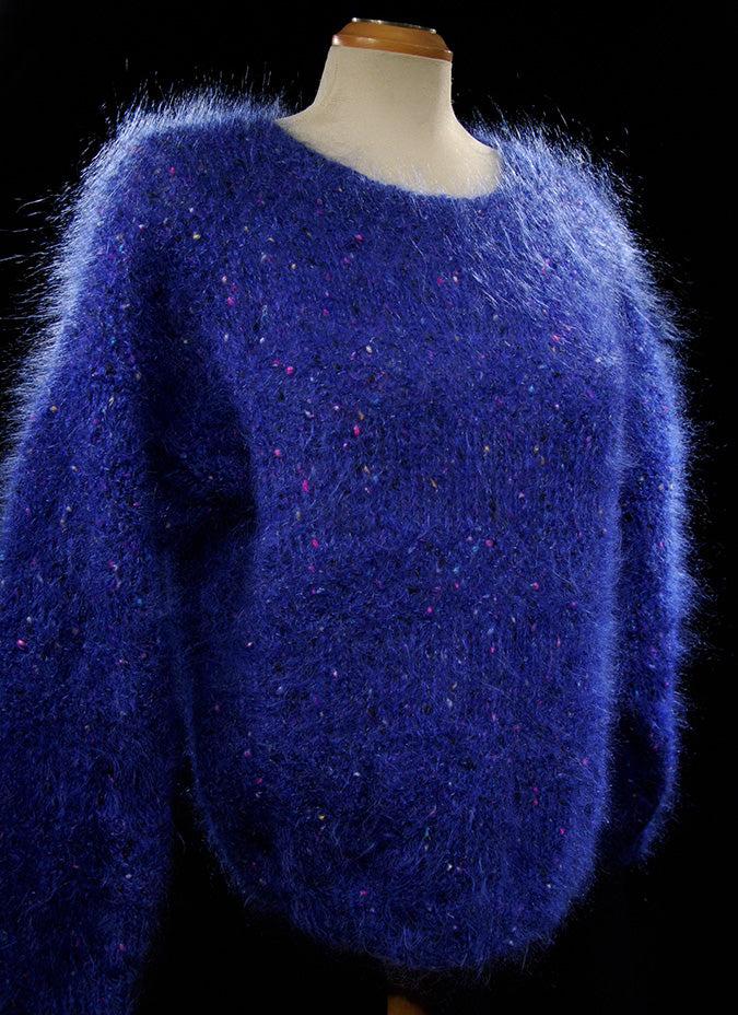 Woman's blue speckled fuzzy mohair sweater with knit-in colorful specks and V-neck design