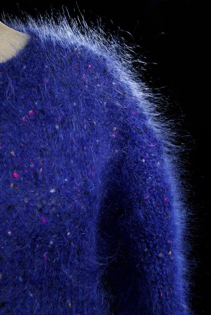 Woman's blue speckled fuzzy mohair V-neck sweater with multicolor knit specks by Icelandic design