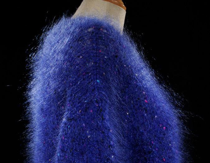 Woman's fuzzy blue speckled mohair V-neck sweater by Icelandic Design with multicolored knit-in specks, medium size, pre-owned.