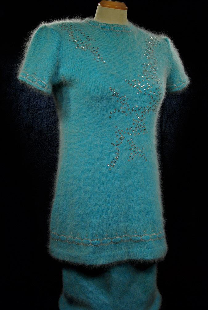 Woman's two-piece matching aqua angora sweaterdress outfit with silver sequins and rhinestone embellishments