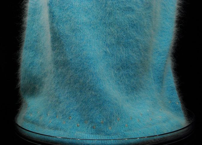 Woman's two-piece matching aqua angora sweater dress outfit with silver sequins and rhinestone trim