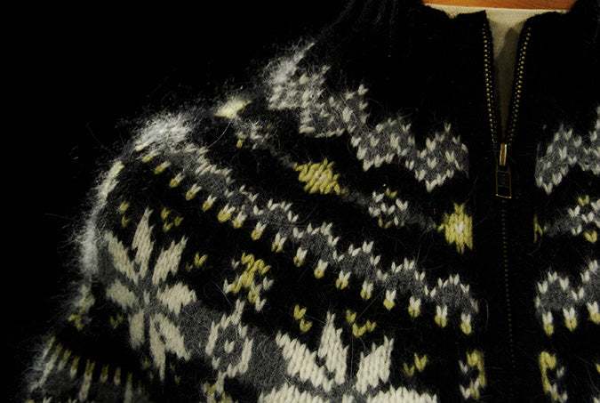 Woman's black and pale-yellow angora zipper-front sweater with snowflake pattern