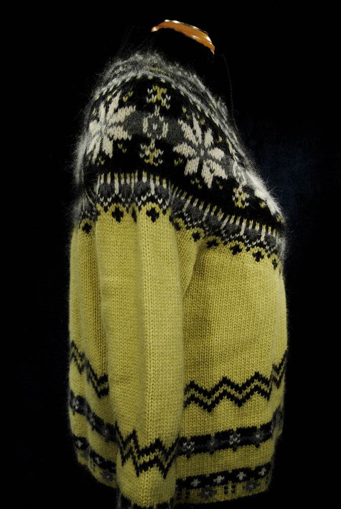 Woman's black and pale yellow angora turtleneck sweater with snowflake zipper-front design