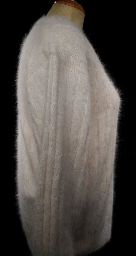 Woman's white angora rib-knit V-neck sweater by Christine Phillipe in small size displayed on mannequin side view