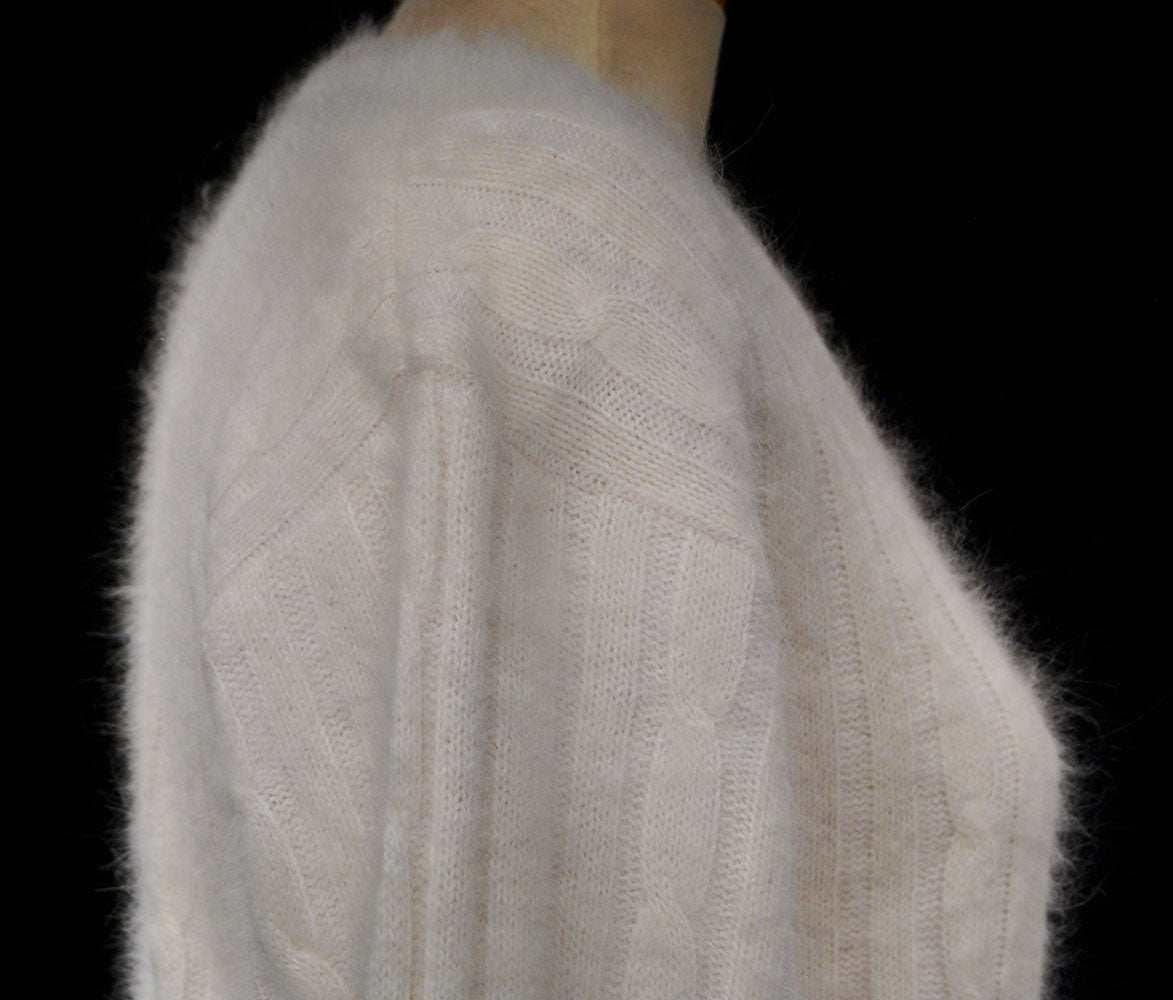Woman's white angora rib-knit V-neck sweater in small size displayed on a mannequin