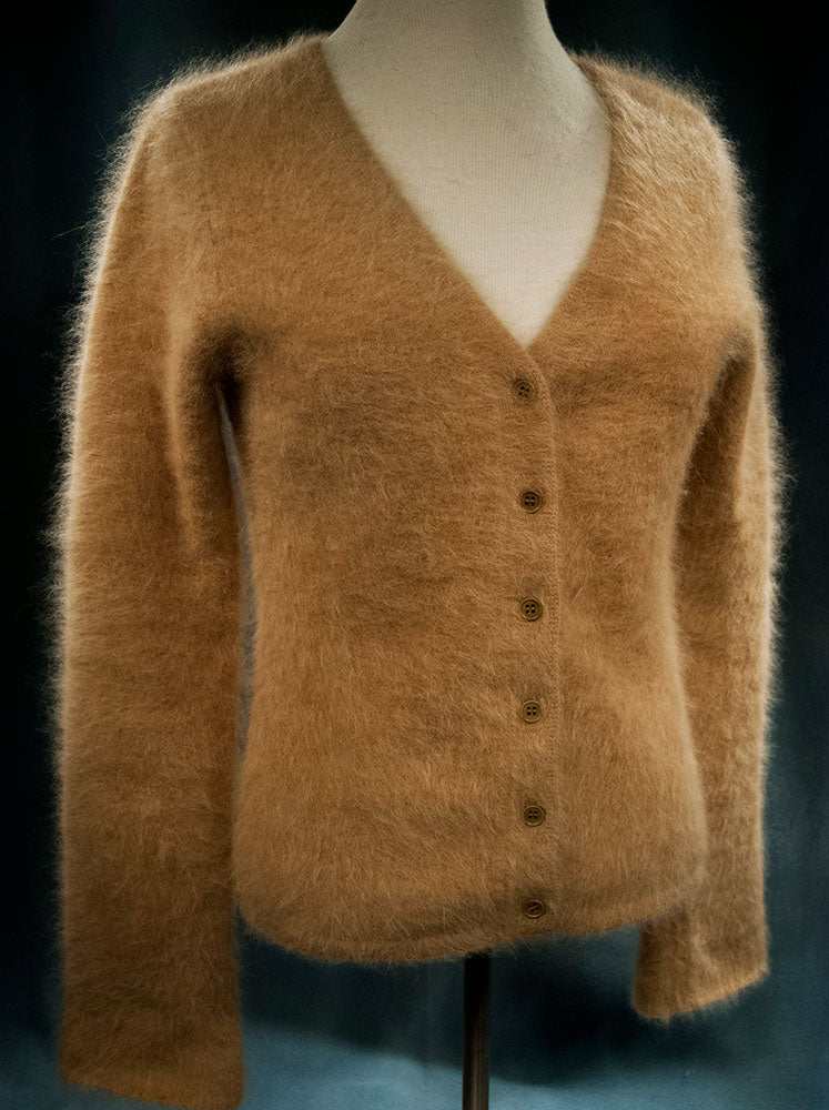 Beige woman's angora cardigan sweater by J.Crew in small size on mannequin
