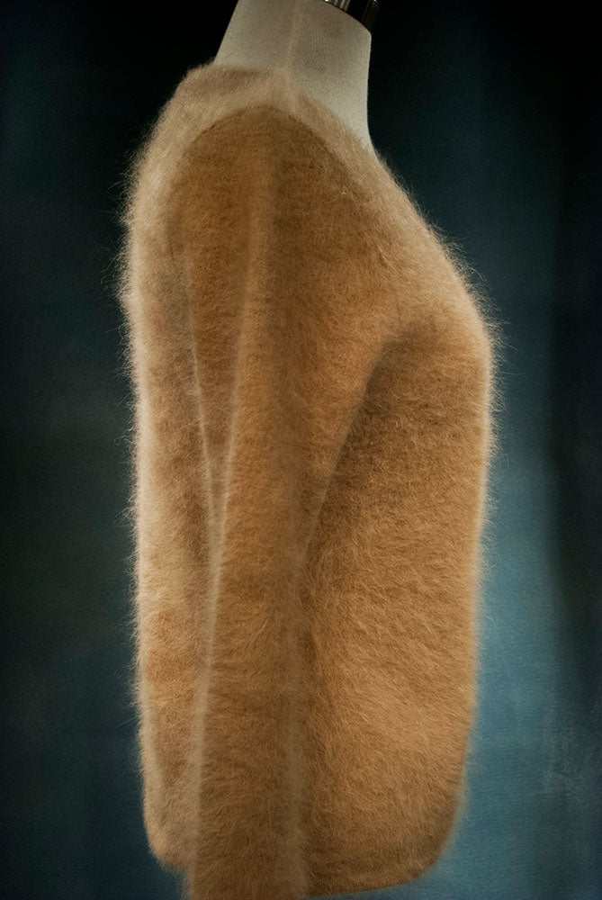 Beige woman's angora cardigan sweater by J.Crew in small size displayed on mannequin side view