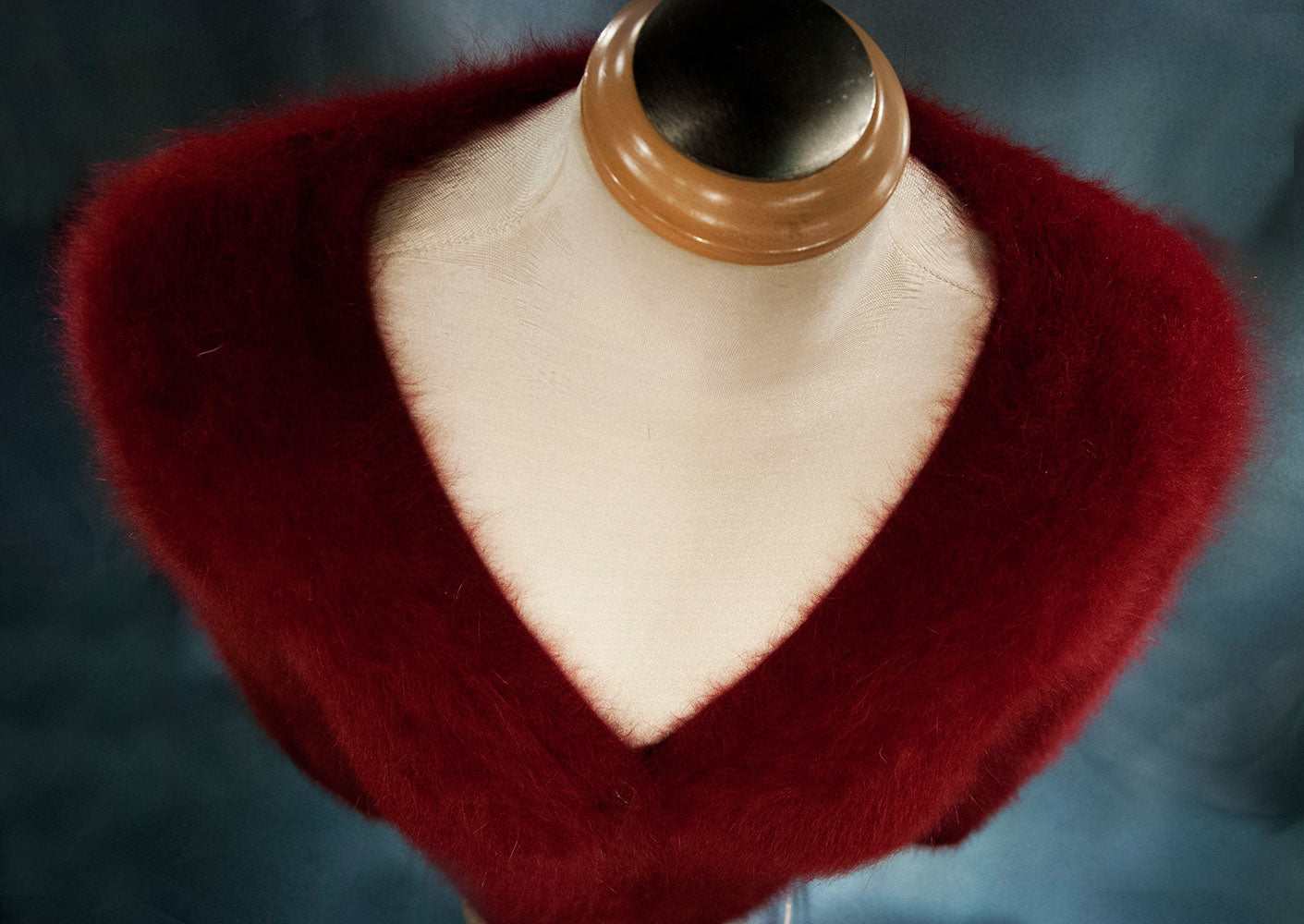 Red woman's angora cardigan sweater by J.Crew displayed on a mannequin.