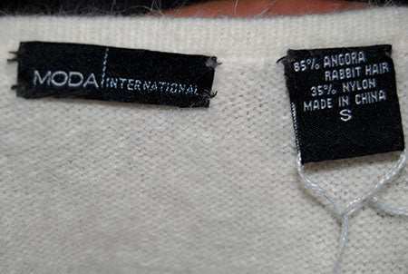 Ivory white Angora sweaterdress with cowl neck and open back by Moda International