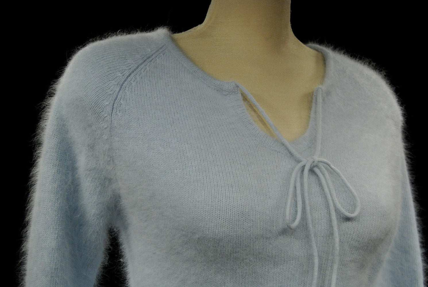 Powder blue fuzzy angora tie-neck sweater for women with soft texture and long sleeves