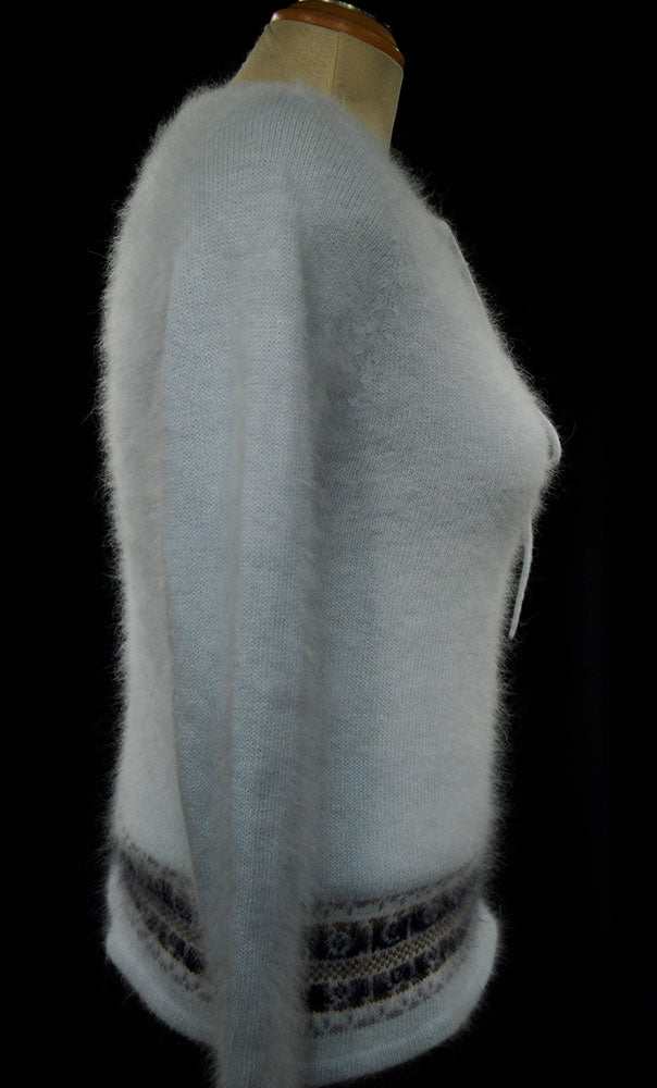 Powder blue fuzzy angora tie-neck sweater with blue and grey horizontal stripes on mannequin