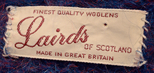 Label of Lairds of Scotland on men's navy-blue crewneck Scottish mohair sweater
