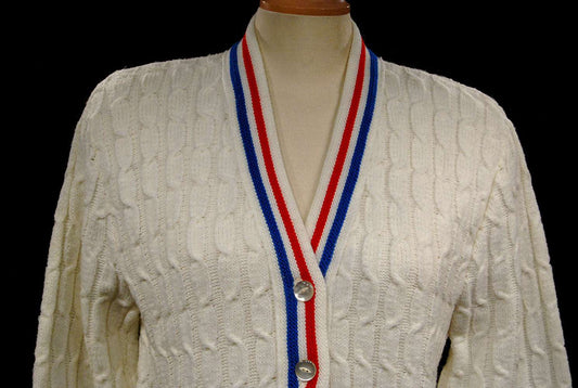 Women's retro white cable-knit cardigan tennis sweater with red and blue trim stripes