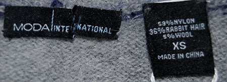 Close-up of blue and grey striped angora scoop-neck sweater label by Victoria's Secret in size XS