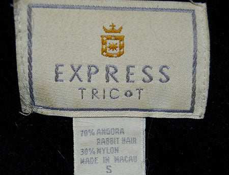 Express Tricot label on woman's black angora blend sweater tag