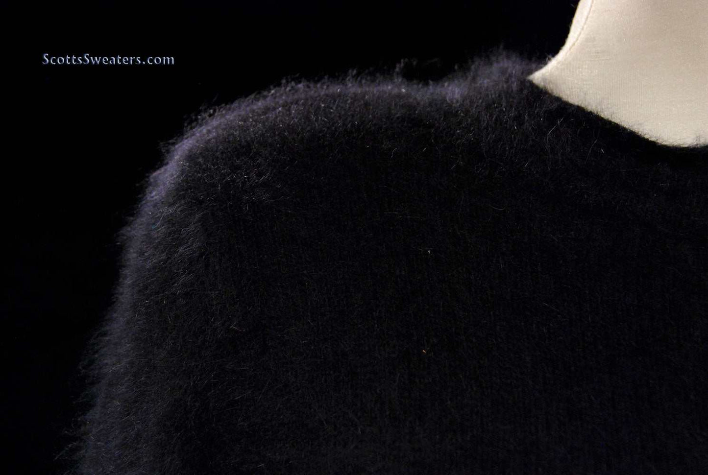 Woman's black angora crewneck sweater by Express Tricot displayed on mannequin