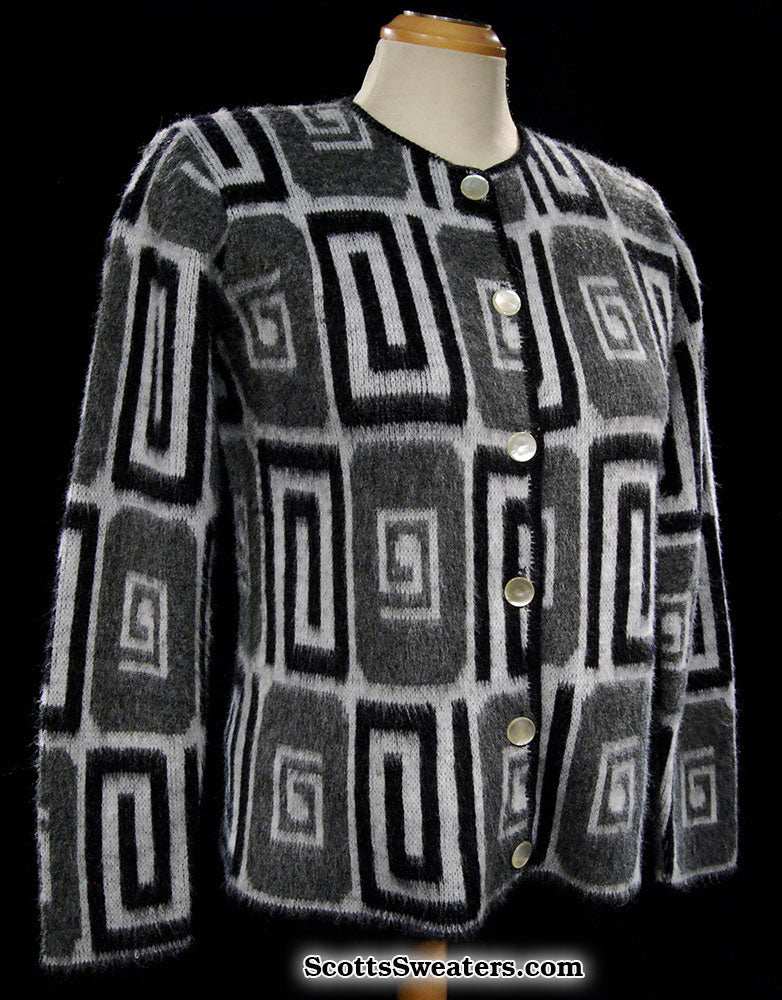 Woman's retro Mad Men's era faux mohair cardigan sweater in black, white, and grey with psychedelic swirl pop-art design