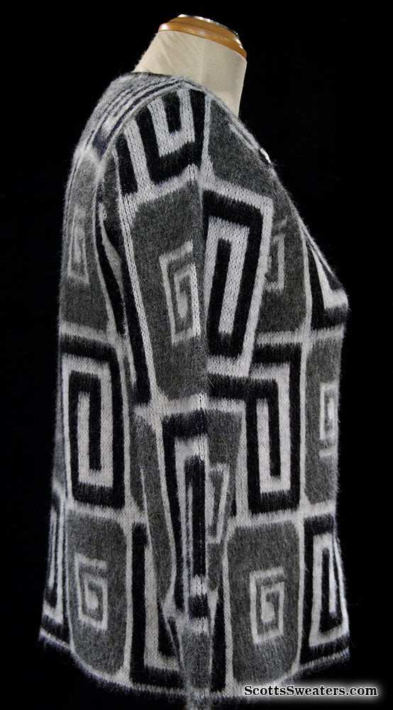 Woman's retro Mad Men's era black and white faux mohair cardigan sweater with psychedelic swirl pop-art design