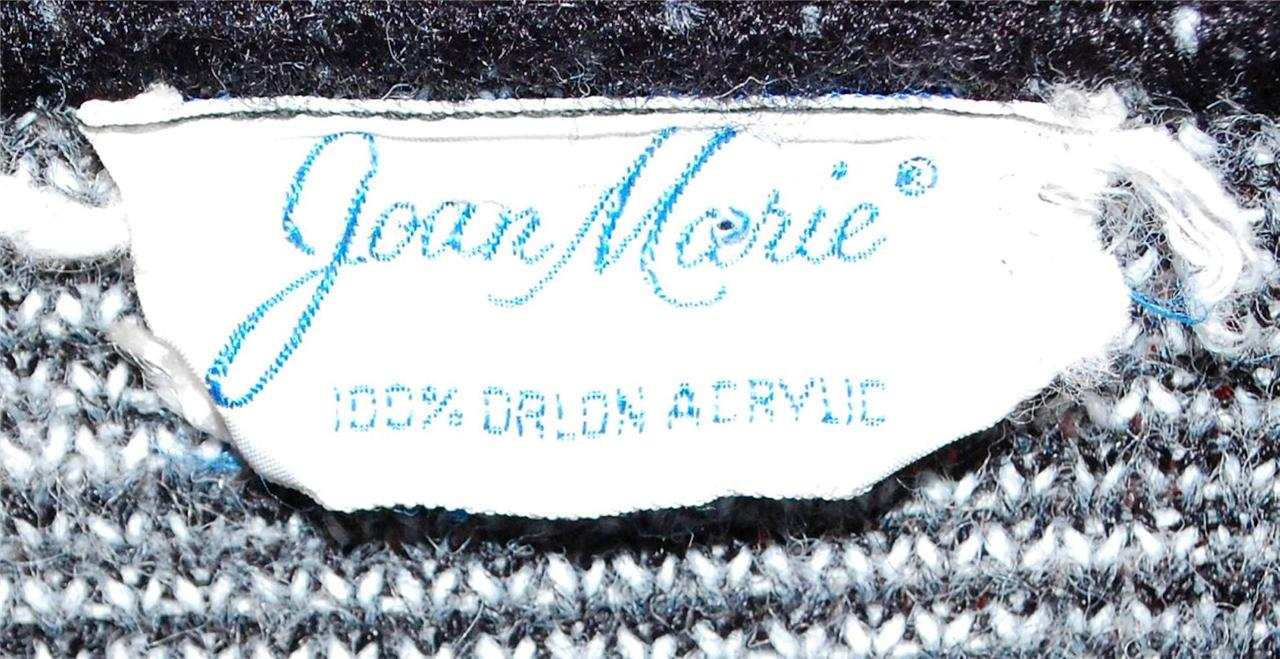 Joan Marie label on black, white, and grey retro faux mohair cardigan sweater from Mad Men's era with swirl pop-art design.