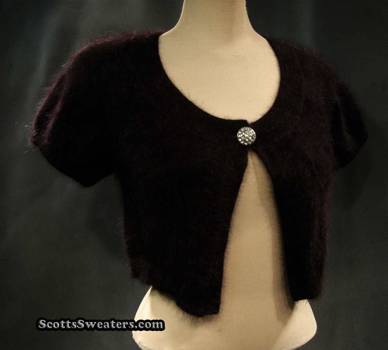 Woman's black angora shrug cardigan sweater with jeweled rhinestone button by Express