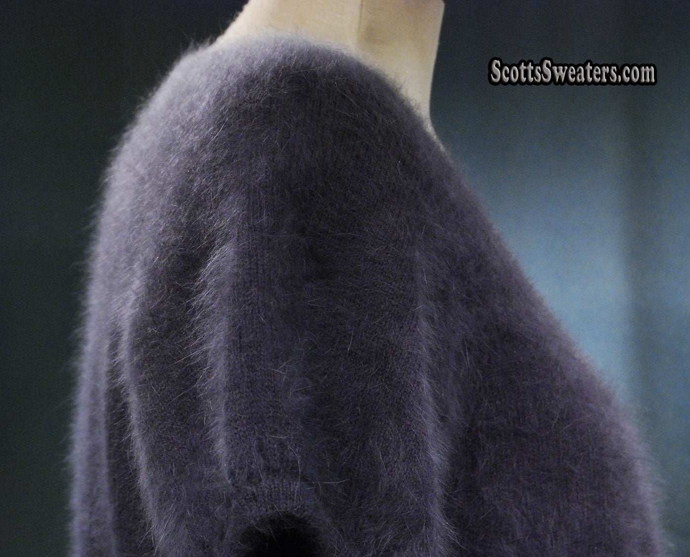 Woman's angora shrug cardigan sweater with jeweled rhinestone button by Express in dark color