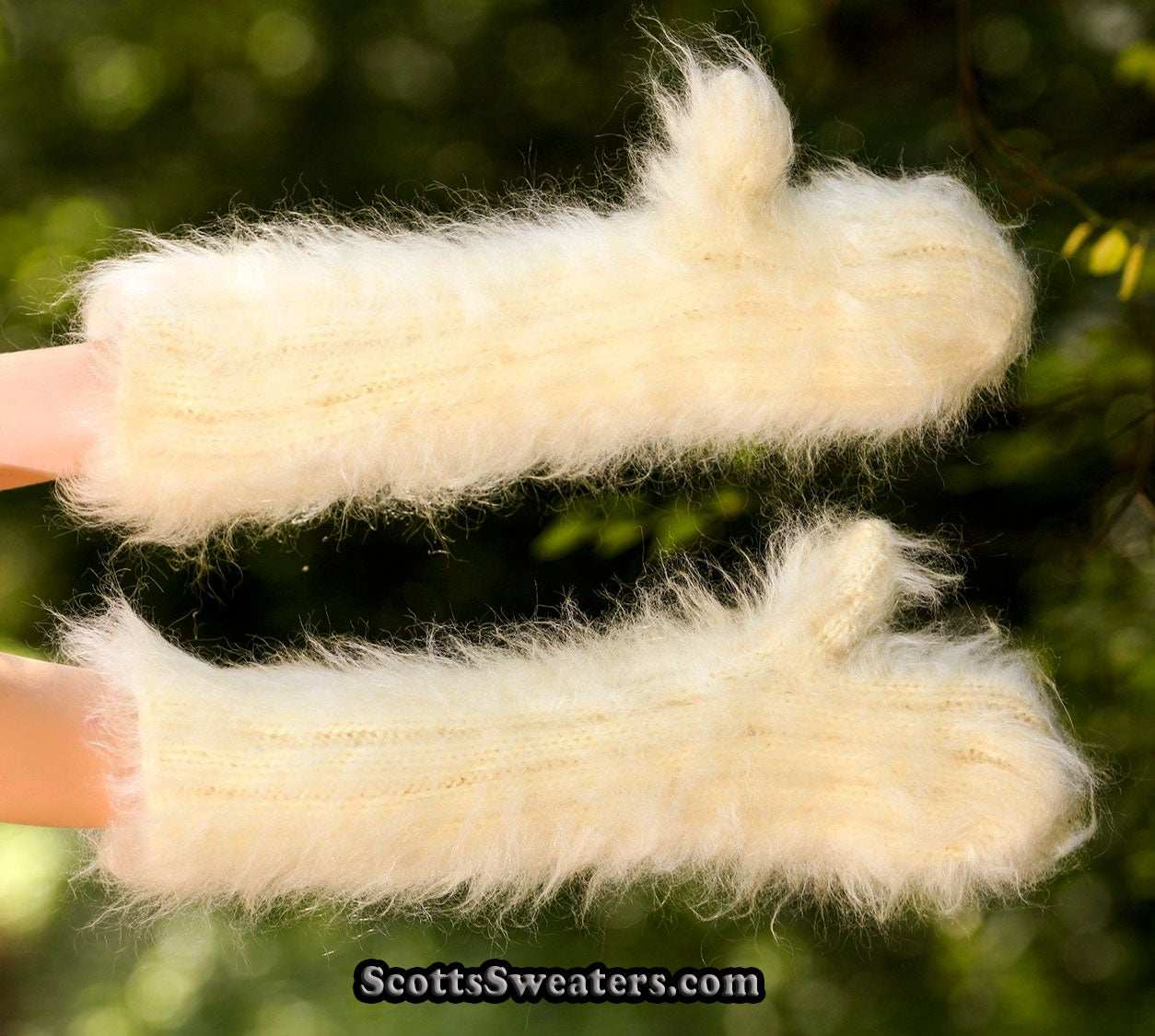 Forearm length fuzzy hand-knit mohair mittens in cream color with extra-long rib knit design