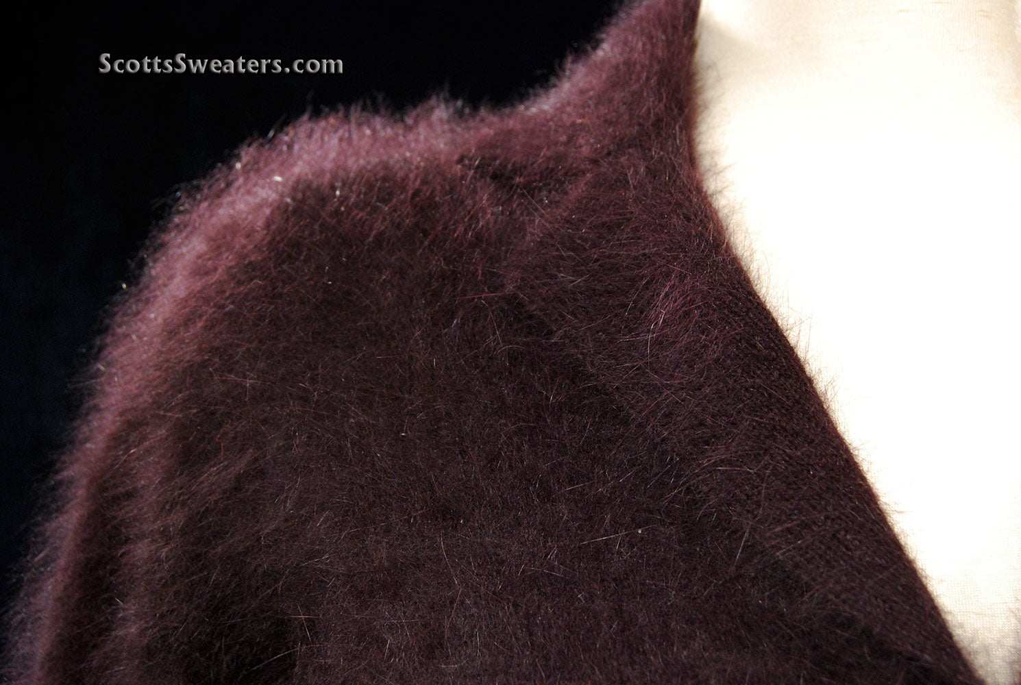 Woman's luxurious brown angora shawl-collar pullover sweater with buttons and narrow waist belt by Monsoon