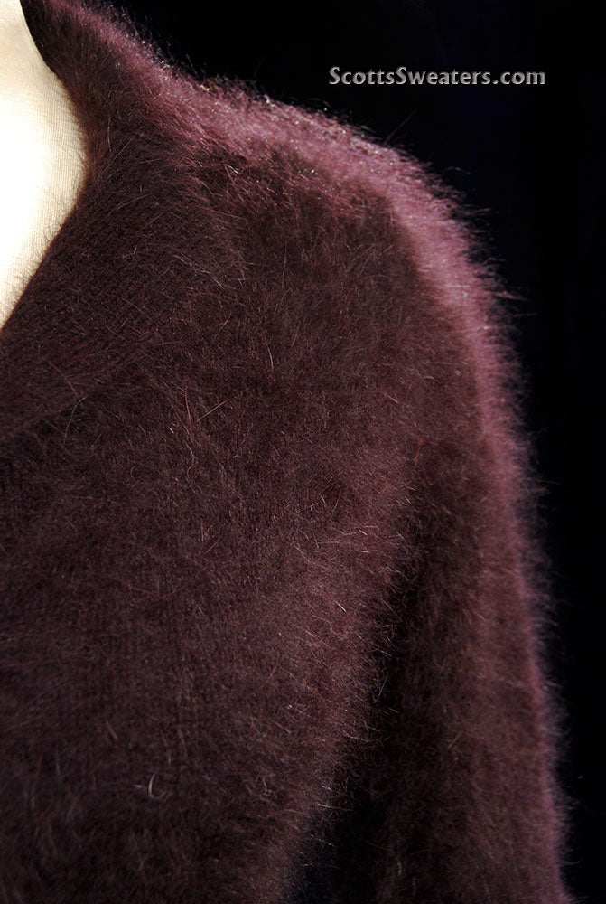 Woman's luxurious brown angora shawl-collar sweater with 3/4 sleeves and narrow waist belt by Monsoon